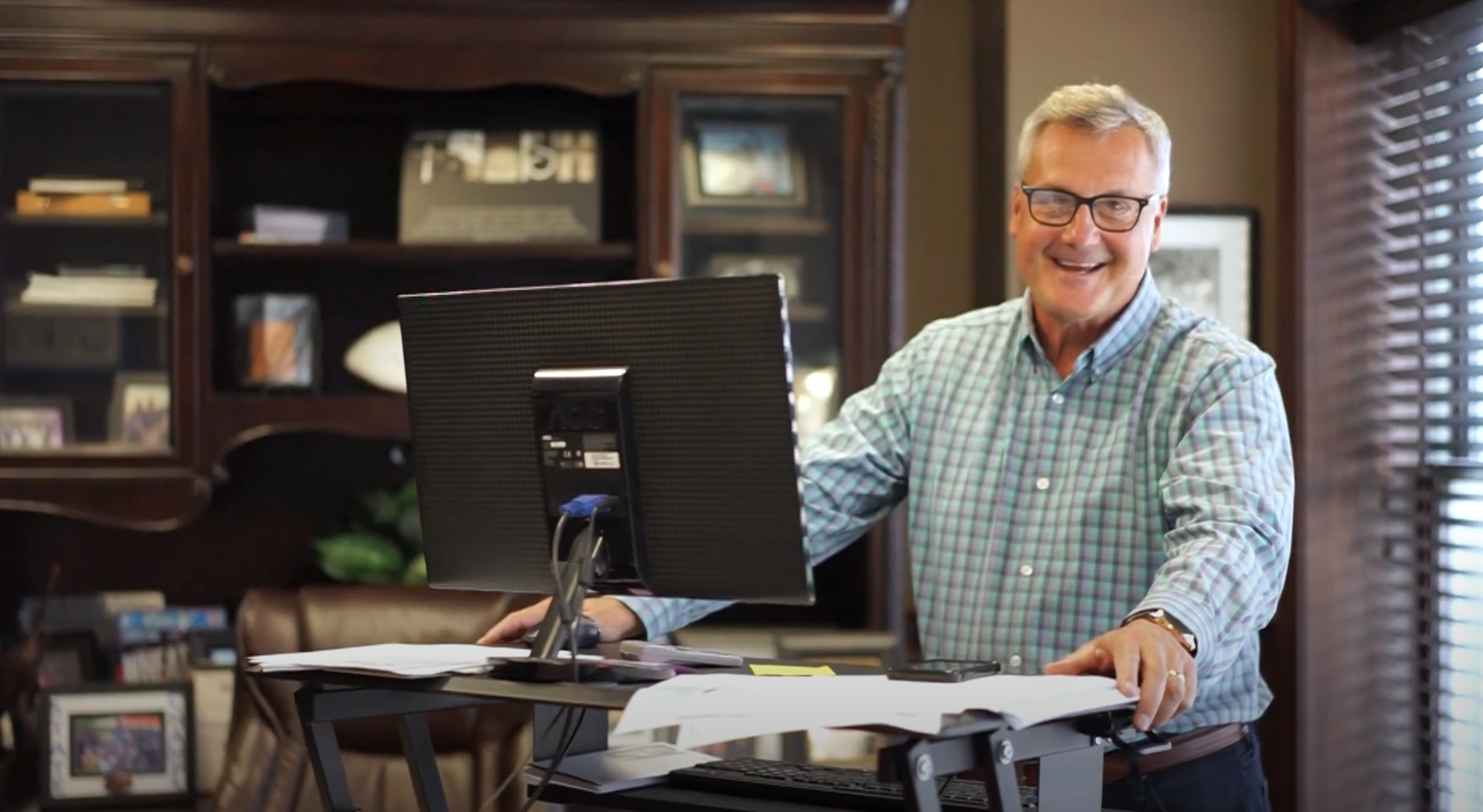 john hockaday behind desk